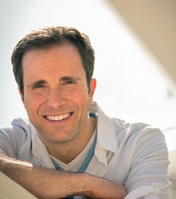 Mike Begala smiling at the beach, guide for the Anxiety Breakthrough session